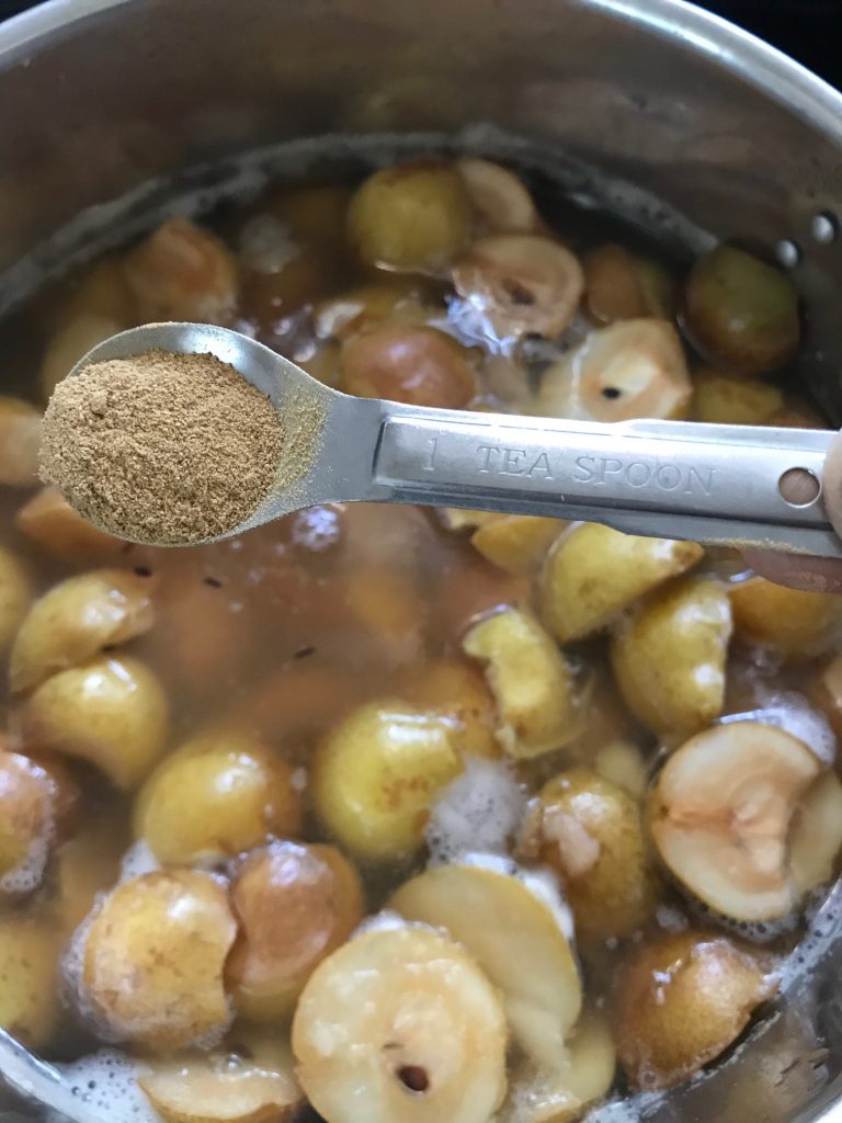 adding ginger to make pear sauce and cider