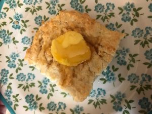 biscuit served with honey and butter