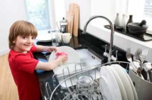 boy doing dishes