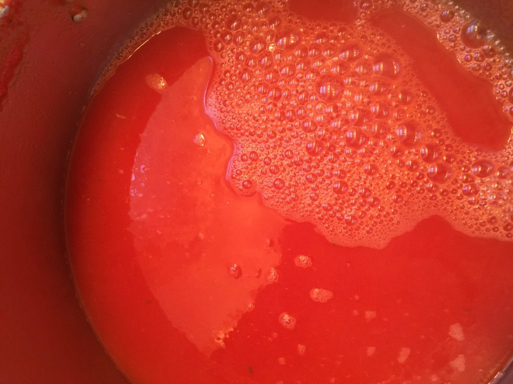 bringing tomato soup to a boil
