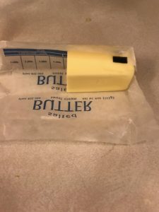 adding butter to cream peas and carrots