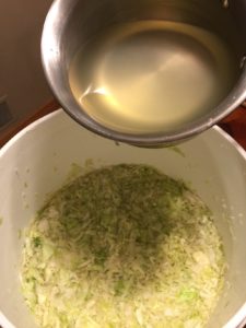 pouring brine over sauerkraut
