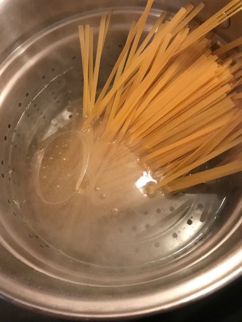 cooking the noodles for chicken Alfredo