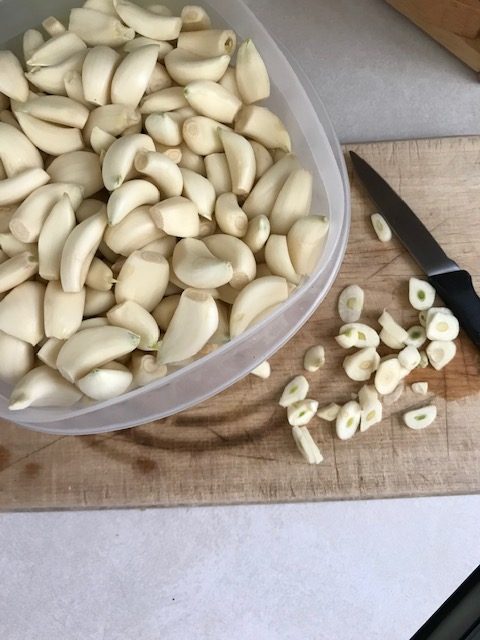 chopping garlic to use in baked asparagus
#heatherearles #herbnwisdom #naturalliving #asparagus #dinnerrecipes #author #podcaster #gardenfood