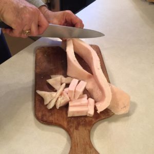 cutting pig fat