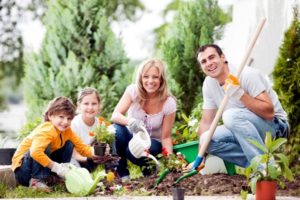 family planting a garden