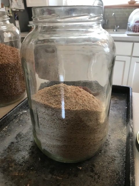 finished ground wheat in a gallon jar