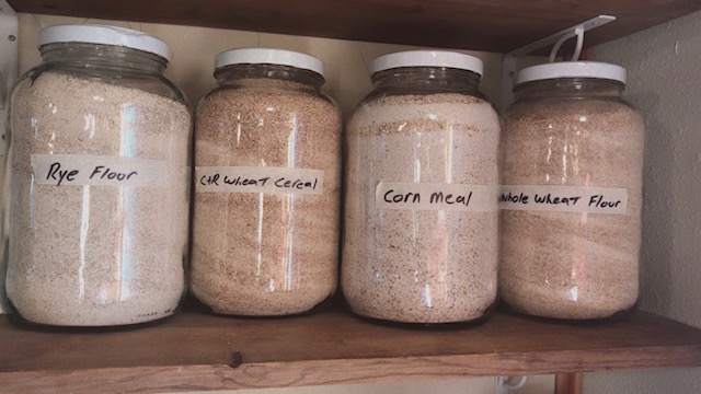 Gallon jars full of wheat flour and cornmeal
#heatherearles #herbnwisdom #naturalliving #grindingwheat #heritagecorn