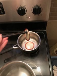 pulling lid from hot water