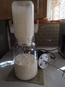 pouring cream into jar