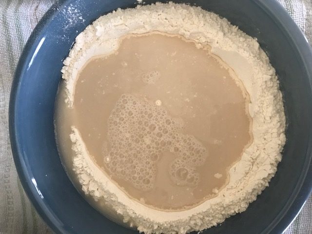 yeast mixture in flour