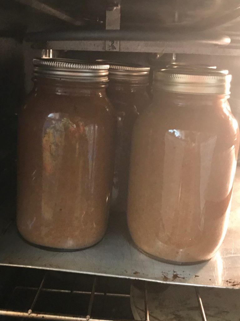 Keeping the jars of pears warm in the oven