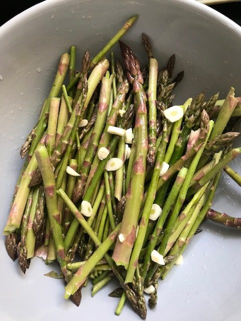 mixing the ingredients for baked asparagus
#heatherearles #herbnwisdom #naturalliving #asparagus #dinnerrecipes #author #podcaster #gardenfood