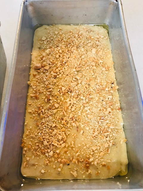 adding nuts to the bread