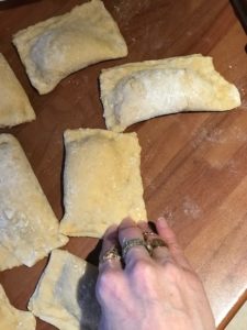 sealing the cottage cheese mixture inside the dough for veronicas