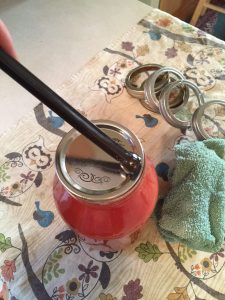 placing lid onto filled jar
