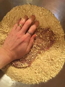 pounding the cubed steak in crackers