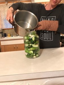 pouring brine into jar