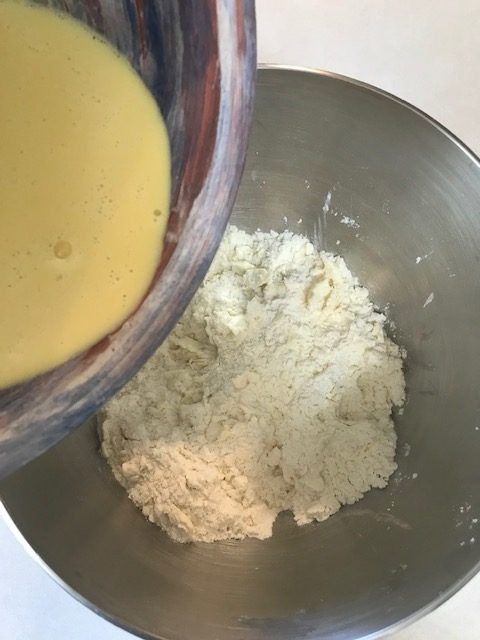 pouring the wet ingredients in with the dry indredients