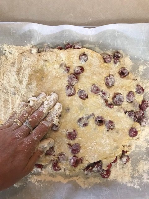 press the cherry scone dough into a 1" disc