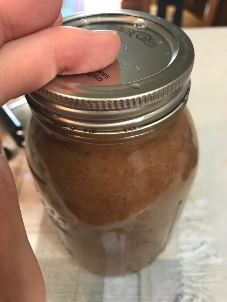 sealing the jar of pears