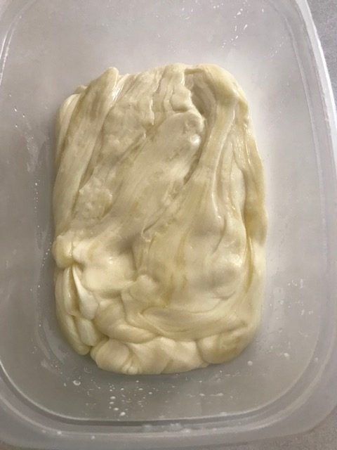 putting the stretched cheese into your choice mold