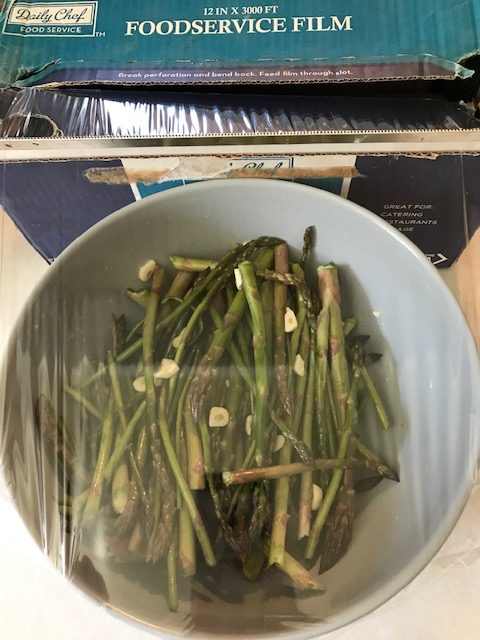 covering the asparagus mixture to put in the fridge.