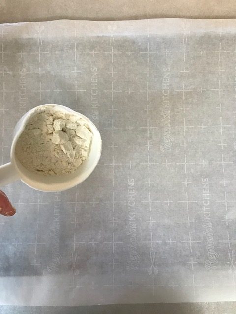 sprinkle flour onto your parchment paper