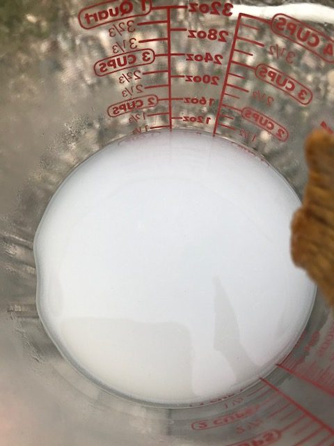 mixing lye into water to make soap