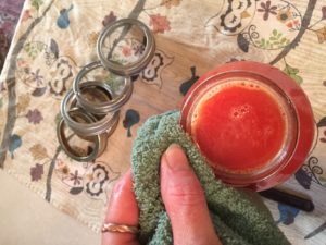 wiping off rim of jar