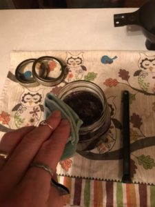 wiping off rim of jelly jar